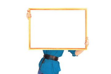a girl in a blue blouse is holding an empty frame for the inscription. Place for design. Mock-up. template