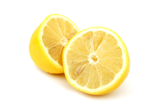 Lemon cut into two halves on a white background. Close up.  