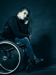 Plakat Sad woman sitting on wheelchair