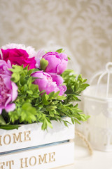 Bouquet of peonies. Peonies and roses. Peonies in a wooden box