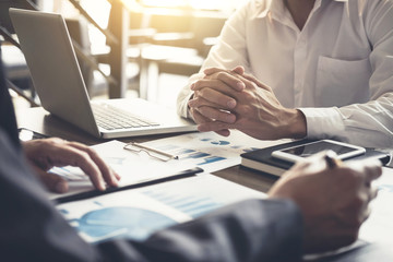 Young businessteam working with new startup project. discussing the charts and graphs showing the results at meeting. Business accounting and financial concept