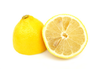 Two halves of lemon on white background