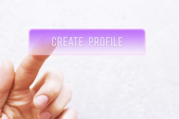 Finger pressing violet transparent - create profile - button on virtual touchscreen on white background with copy space for text or image. Technology, internet, social networking and online customer s