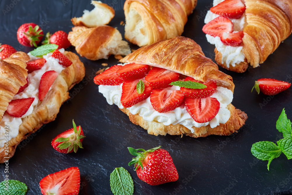 Wall mural french croissant sandwiches with ripe strawberries