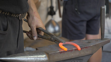 A blacksmith's workshop. Blacksmith forge horseshoe