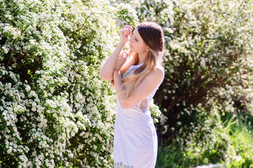 Beautiful young Ukrainian woman in white flowers