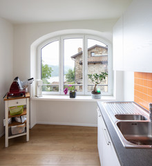 Details of a window in the kitchen with a view. Sink and slicer