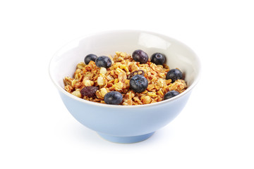 Bowl of homemade granola with fruit pieces isolated on white