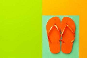 Female flip flops on a colorful vibrant background