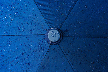Abstract rain water droplet on top umbrella surface in Rainy season background