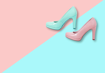 Fashion female pink shoes with heels. Women's footwear casual design isolated on blue background with free space for text.