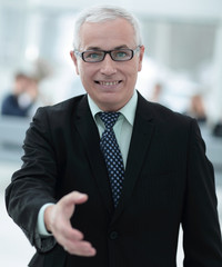Fototapeta premium closeup of a senior businessman offering his hand for greeting.