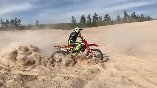 slow motion enduro mx in sand turn 