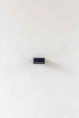 Lamp on emty wall