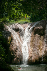 Swimming waterfall from mountain