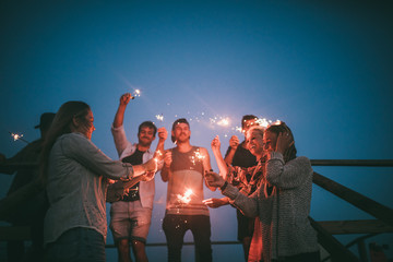 celebrating summernight with friends and sparklers