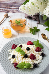 Russian cottage cheese with berries, honey mint, selective focus, healthy Breakfast