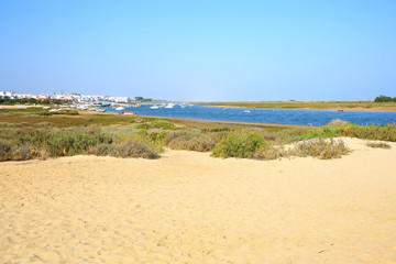 Fototapeta na wymiar The beach in Cabanas near Tavira in Algarve, Portugal