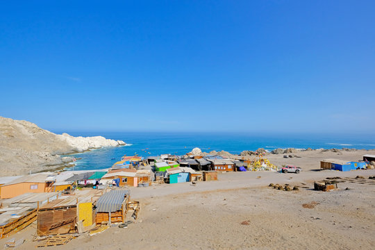 Small colorful fishing village on the pacific coast, south of Iquique, Chile, South America