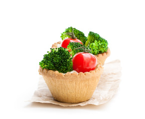 Homemade  salted vegan tarts with cherry tomato and broccoli isolated on white