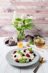 Russian cottage cheese with berries, honey mint, selective focus, healthy Breakfast