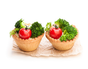 Fototapeta na wymiar Homemade salted vegan tarts with cherry tomato and broccoli isolated on white
