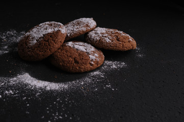 oatmeal cookies on a black table in castor sugar