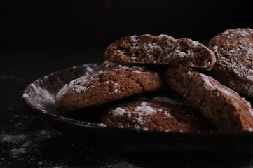 oatmeal cookies on a black table in castor sugar