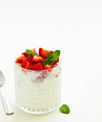 Yogurt with strawberries. Dietary breakfast.