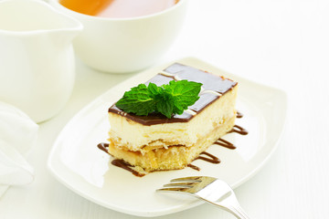 A piece of cheesecake with apple stuffing.
