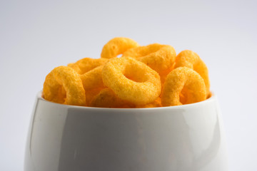 Kaju Katli is a Diamond shape Indian sweet made using cashew sugar and mava, served in a plate or bowl over moody background. selective focus