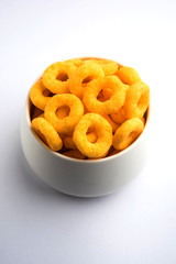 Kaju Katli is a Diamond shape Indian sweet made using cashew sugar and mava, served in a plate or bowl over moody background. selective focus
