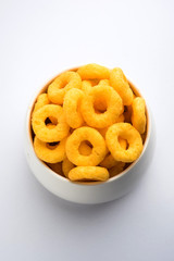 Kaju Katli is a Diamond shape Indian sweet made using cashew sugar and mava, served in a plate or bowl over moody background. selective focus