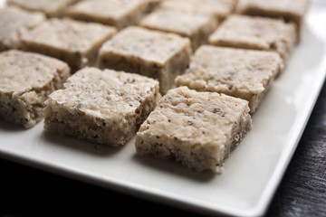 Delicious spicy chicken biryani in bowl over moody background, it’s a popular Indian and Pakistani food.