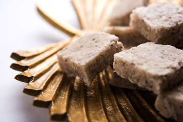 mutton or lamb biriyani with basmati rice, served in a bowl over moody background.