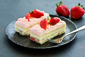 strawberry cake. dark background.