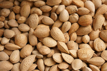 Obraz premium Raw many almonds as background