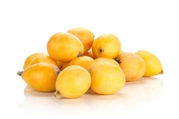 Fresh Japanese loquats stack isolated on white background.