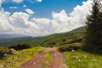Fototapeta na wymiar Mountain landscape view on a valley from mountain peak.