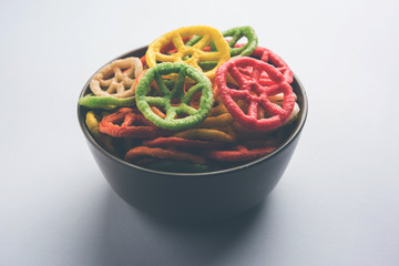 Delicious spicy chicken biryani in bowl over moody background, it’s a popular Indian and Pakistani food.