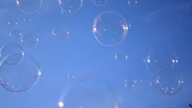 Slow motion fly of a big soap bubble in a city center public place in Wroclaw Poland