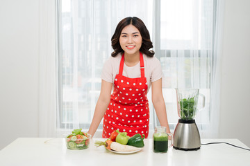 Healthy lifestyle. Happy smiling on kitchen home with green vegetables cooking