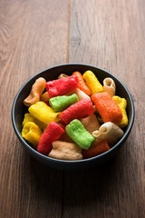 Basundi Or Rabri is an Indian sweet popular in Gujarat and Maharashtra. It is a sweetened condensed milk. Garnished with Dry fruits and Saffron. Served in a bowl over moody background. Selective focus