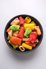 Delicious spicy chicken biryani in bowl over moody background, it’s a popular Indian and Pakistani food.