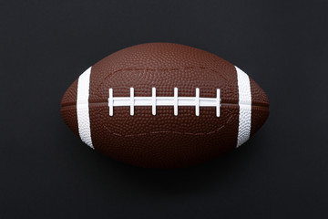 American football isolated on black background . Sport object concept
