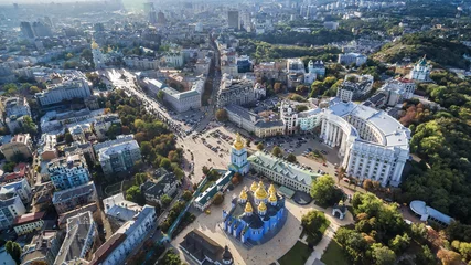 Foto auf Acrylglas Aerial view on Mikhaylovsky Zlatoverkhy the monastery, the building of the Ministry of Foreign Affairs of Ukraine and houses near Mykhailivs'ka Square and Sofia Kyivska. © Dymov