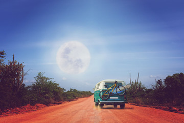 Traveling camper with bike and surfboard in Australia.  Holiday trip in motorhome, Caravan car Vacation