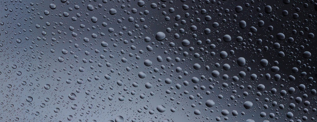 Water drops color background rain glass space rainbow.