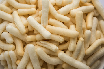 Kaju Katli is a Diamond shape Indian sweet made using cashew sugar and mava, served in a plate or bowl over moody background. selective focus