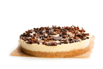 Caramel  cheesecake with chocolate flakes isolated on white